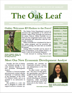 Photo of the cover of the Oak Leaf news letter with Police K-9 Harkon and new Economic Development Analyst